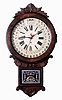 Wm. L. Gilbert Clock Co., Winsted, Conn., "Office Drop Calendar", wall clock, 8 days, time and calendar, spring driven movement in a walnut case with burled highlights with a painted zinc dial and silk screened lower tablet, c1885