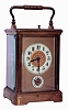 France, repeating carriage clock with alarm, gilt Corniche case with bevelled glasses, Arabic numeral white enamel dials with matted gilt mask, blued steel hands, 8 days, time, strike, and alarm movement with lever platform, petit sonnerie quarters, and grand sonnerie repeating, with sonnerie/ silent lever in base, c1900