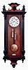 German, Gustav Becker, "Vienna Regulator" 2 weight, gong striking wall clock in a walnut veneer case with black finials and accents, c1890