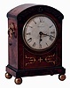 Hordern, Leamington, England, bracket clock in the Regency style, oak case with figured mahogany veneer, brass inlay and applied carved ornament, brass ball feet and carrying handles, brass bezel with convex glass, Roman numeral white painted sheet iron dial, 8 days, fusee timepiece movement, c1835