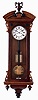 Lenzkirch, Germany, hanging regulator, walnut and walnut veneer case with ebonized trim, the door with applied, pierced scrolls at top and bottom, molded, broken arch top, with turned, ebonized bosses flanking a central plinth with urn finial, bottom with deeply molded bracket and turned drops, Roman numeral white enamel dial with seconds bit below 12:00, and signed "M.C. Unserud, Odense", fancy blued steel hands, ebonized pendulum rod with polished brass ball, weight driven, time and strike movement, serial #340935, c1870