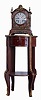 Lenzkirch, Germany, shelf clock of typical bracket clock form, mahogany and burled mahogany veneers with classically inspired applied ormolu castings and caryatid corners, gilt scroll feet, gilt flame finials, and medallion centered gilt frets. The silvered Roman dial ring has a regulating adjustment, blued steel hands, 8 days time and strike movement with ting tang striking, serial # One Million 9277, also marked "52", c1894 including period one drawer round mahogany stand with brass trim