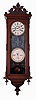Ithaca Calendar Clock Co., Ithaca, NY, "No. 3 Vienna" wall clock, 30 days, time and perpetual calendar, spring driven movement manufactured by E.N. Welch in a walnut case with papered metal dials and black mask with gold incising, c1880