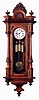 Gebruder Resch, Germany, "Vienna Regulator" wall clock, 8 days, time and grande sonnerie, three weight driven movement in an Alt Deutsche style carved walnut case with ebonized accents and white enamel dial, c1875