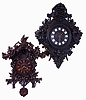 Clocks- 2 (Two) European carved walnut, 8 days, spring wound, time and strike wall clocks: French hanging clock with Paris retailer sticker inside, square brass movement; German Black Forest cuckoo, large movement with skeletonized cast brass plates; late 19th century