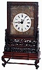 Chinese Large Bracket mantel clock, 8 days, time and quarter strike on two bells, spring driven movement with fusee, verge escapement and center sweep in a three piece Chinese highly and well carved rosewood case including bracket and swivel base with white enamel dial and engraved brass dial surround, circa late 19th century, some parts later