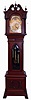 John J. Elliott, London, England (attribution) for Simons Bros. Co., Philadelphia, Penn., tall clock, time, strike and Westminster and Whittington chime on 8 bells and four gongs, 8 days, three brass weight driven movement in a mahogany case with full reeded Corinthian columns, beveled Gothic arch glass in trunk door, paw feet, carved wreath on center of plinth and carving above and below trunk, The hood has broken arch top with turned rosettes, fretwork sides, carved leaves on chimney under center finial and full reeded Corinthian columns. The brass dial has ornately cutout and engraved brass corner spandrels and profusely engraved dial center, silvered chapter ring with applied brass numerals, hour strike / silent and Westminster and Whittington selectors and moon phase dial, c1910