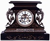 Ansonia Clock Co., New York, NY, "Rosalind" enameled iron case mantel clock with a spring driven, 8 days, time and hour/half-hour strike movement with a visible escapement, c1904.