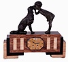 French Art Deco marble and petrified wood (?), 8 days, time and strike mantel clock with girl and dog bronzed spelter top figures, Marti movement with count wheel striking, c1925