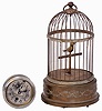 Items- 2 (Two): (1) Boston (Chelsea) Clock Co., "Auto Clock A", 8 days, nickel plated timepiece #12401B, c1912; (2) French "Helvetic" singing bird in brass cage, c1930