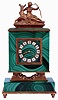 Switzerland, malachite and silver gilt desk or bedside clock, stone base with gilt molding and feet, the square clock case on cast architectural supports with scrolls and acanthus leaf decoration, the top with gilt figure of Diana and a deer, rear door gilt and with engraved decoration, Roman numeral gilt and white enamel chapter ring with fancy gilt hands, time and alarm movement with lever escapement, c1960