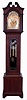 Tiffany & Co., New York, 9 tube hall clock, 8 days, time, strike and chime, three weight driven movement by Elliot, London, playing three tunes (Westminster, Whittington and St. Michael's on tubes signed with patent date Dec. 4th 1906) in mahogany, string inlaid case on bracket base, broken arch hood with turned rosettes, beveled glass door in trunk and hood. The brass arched dial has a silvered chapter ring with applied brass numerals, surrounded by a finely engraved foliate mask, turned spandrels and dial center, moon phase, selection for chime or silent and tune, and second's bit, c1915