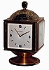Bucherer, Swiss, 8 days, 15 jewel globe-top brass and beveled glass clock with calendar and weather station, rotating base, c1970