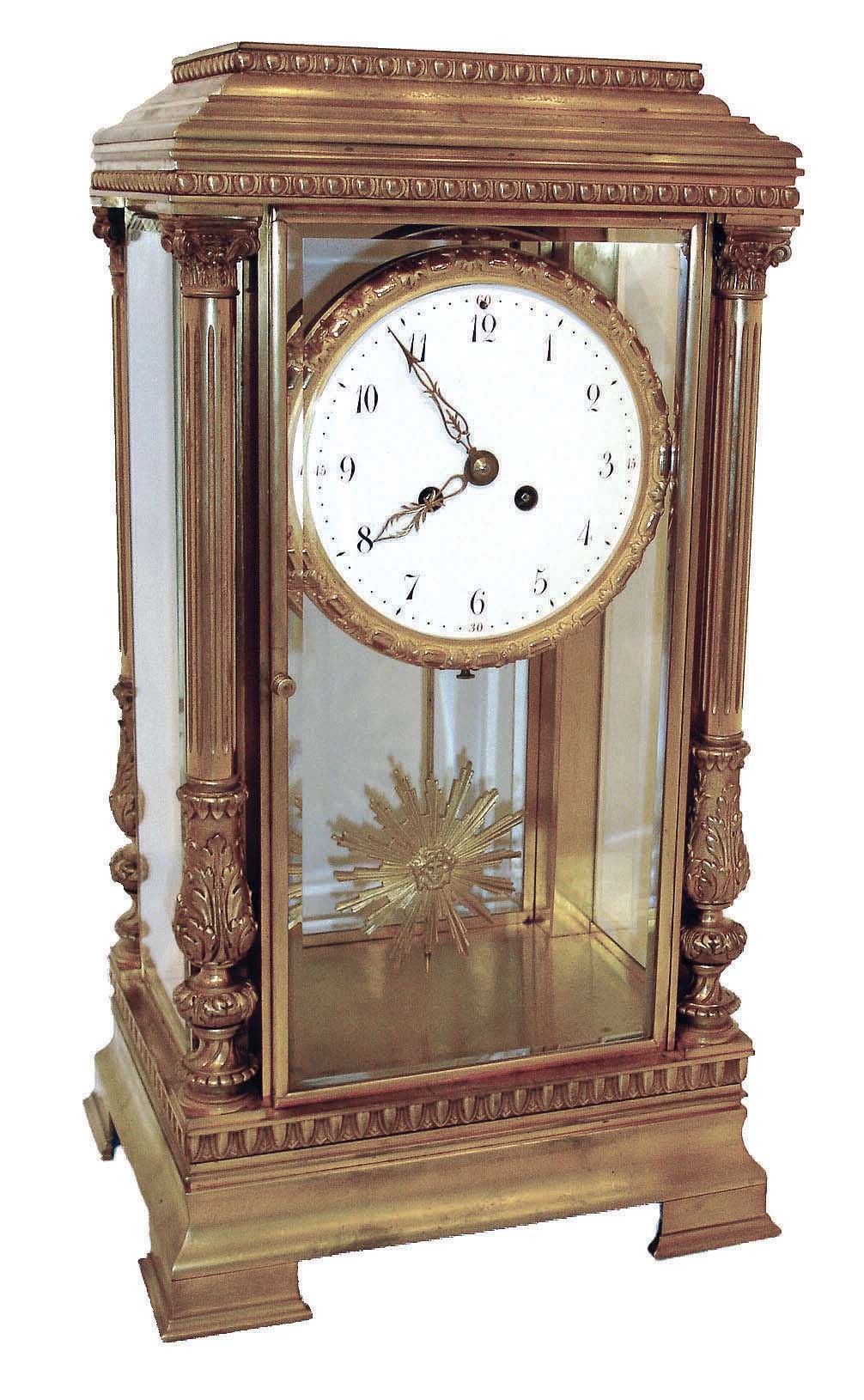France, extra large "crystal regulator", the dial surrounded by a fancy cast and gilt bezel, the pendulum of sun-burst motif, and the case corners with full Corinthian reeded columns, and all sides with heavy beveled glass, the 5.6" porcelain dial with Arabic numerals and finely pierced hands, c1850 — Antique Clocks Price Guide
