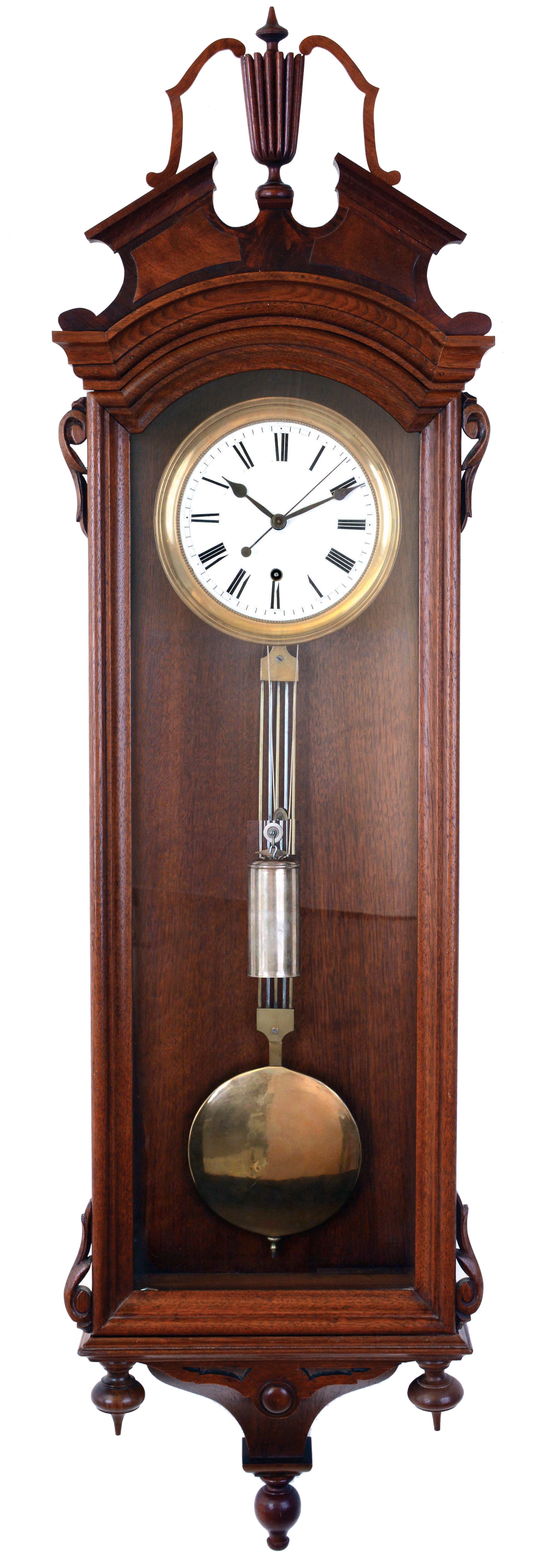George A. Jones & Co., New York, hanging regulator, 8 days, time only weight driven movement with sweep center seconds in a walnut, Vienna-style regulator case with Roman numeral white enamel dial, gridiron pendulum with brass ball, c1875. — Antique Clocks Price Guide