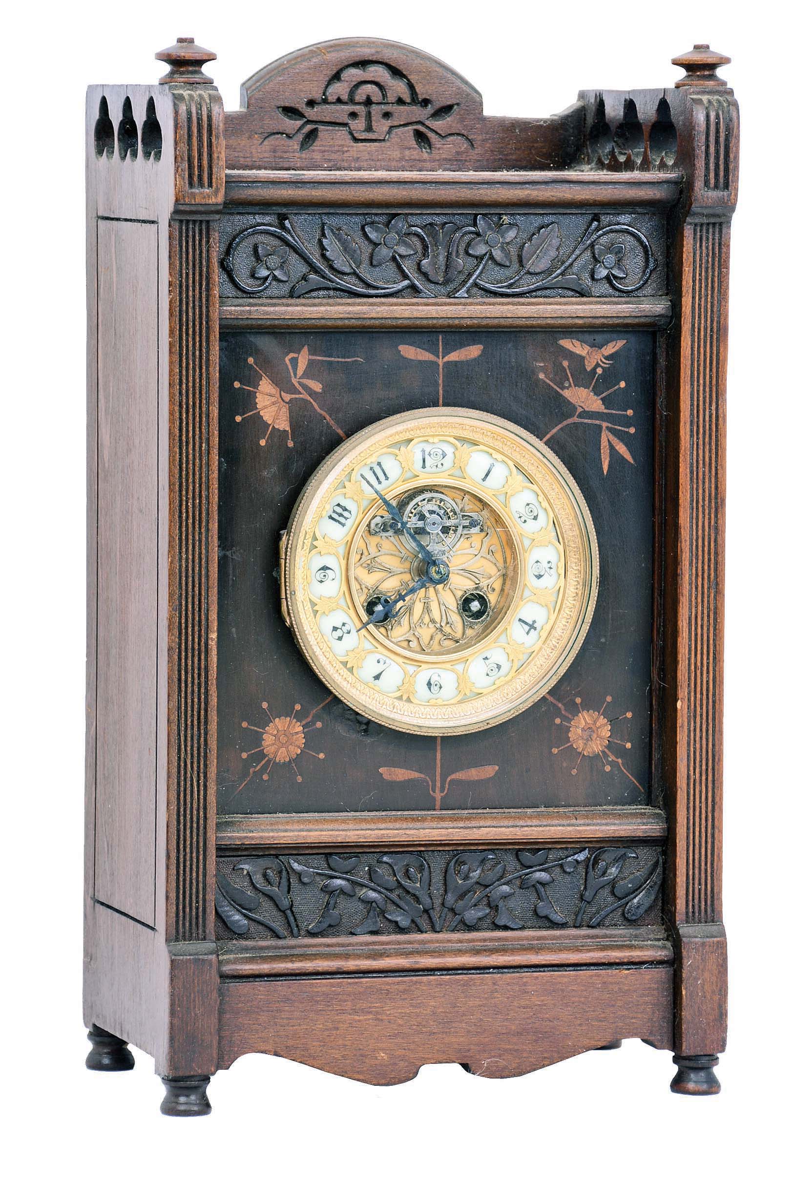 Clocks- 2 (Two) Seth Thomas Clock Co., Thomaston, Conn, mantel clocks: (1) a "Bee" in an ebonized and mahogany case, c1881, now fitted with a French 8 day time and strike lever movement; (2) cottage clock with octagon top and reverse painted tablet and Seth Thomas hands — Antique Clocks Price Guide
