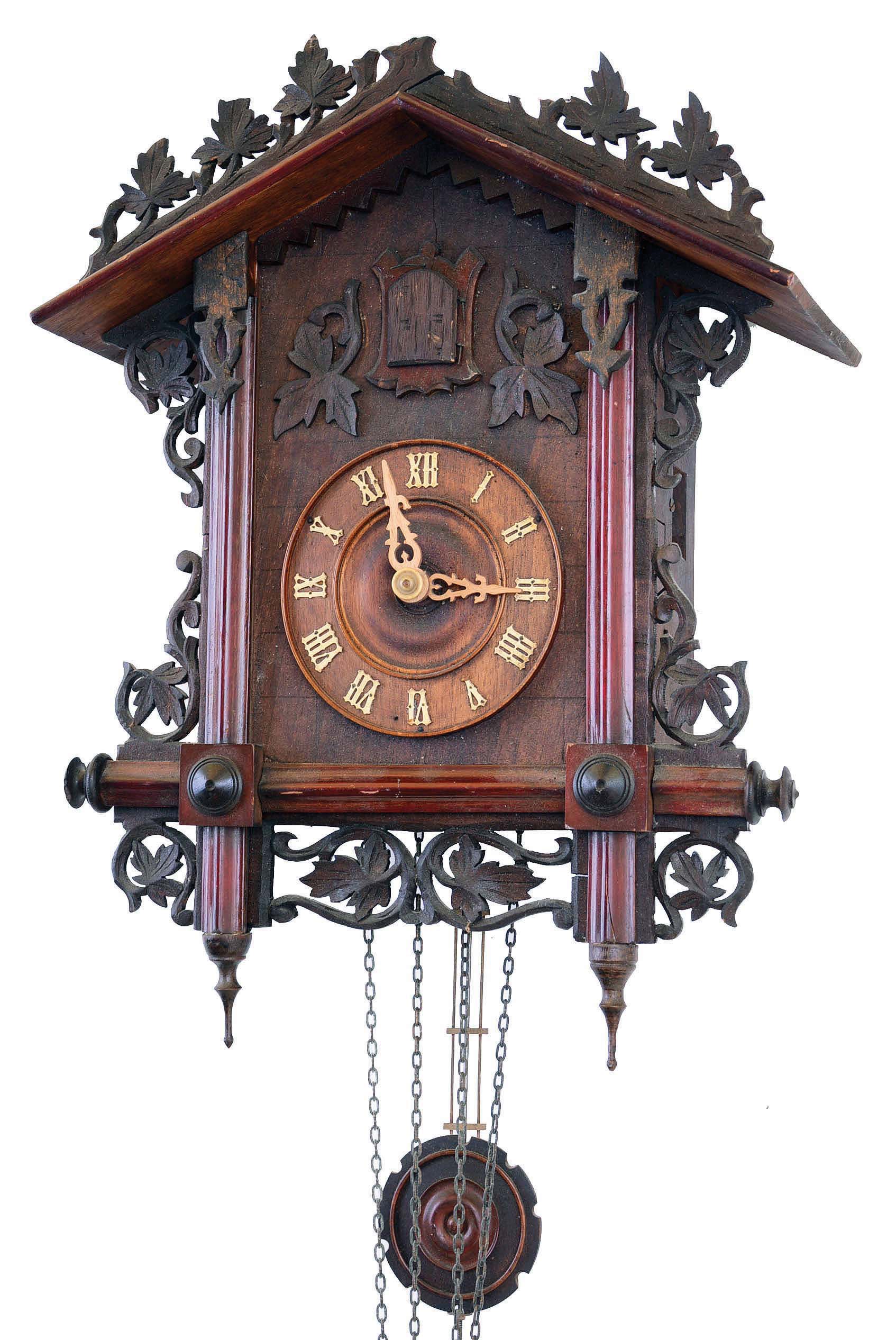 Clocks- 2 (Two) Cuckoo German 2 weight carved wood hanging clocks: (1) Gordian Hettich & Sohn antique 30 hour railway style, c1900; (2) Schatz modern 8 day with hunter motif of rabbit, bird, guns, etc.; — Antique Clocks Price Guide