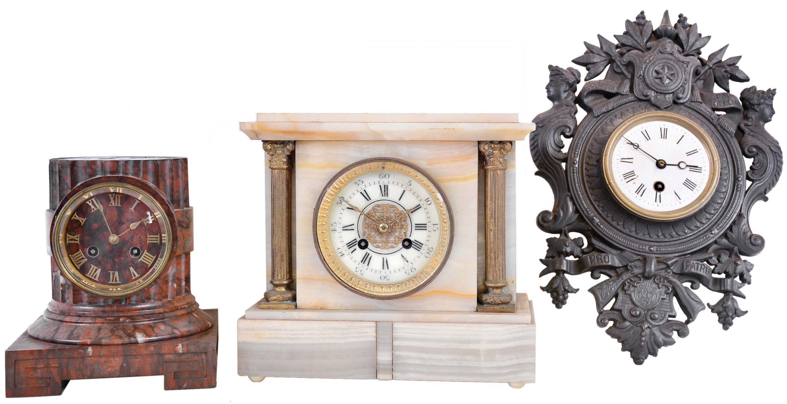 Clocks- 3 (Three) French 8 day: (1) time only cast iron cartel wall clock, Japy tic-tac movement, Latin inscription meaning "if you want peace, prepare for war"; (2) time and strike white onyx mantel with gilt columns and bezel, Japy Freres movement; (3) time and strike red marble column mantel, unsigned movement; c1890 — Antique Clocks Price Guide
