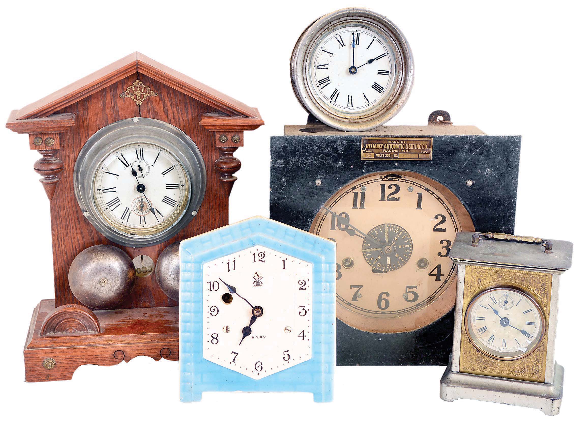 Clocks- 12 (Twelve): (1) Wooden works shelf clock with an unidentified Connecticut 30 hours time & strike movement in an unusual mahogany veneered case. c1830; (2) Electric Light timer by Reliance Automatic Lighting Co., Racine, Wisconsin. (3) Oversized shelf model alarm clock of American origin; c1910. (4) Small electric clock of unknown manufacture; (5) Alarm clock mounted on wooden stand; manufacturer not identified; c1910; (6) Slave clock of unidentified origin.; (7) Waterbury Clock Co., Waterbury, Conn., "Tourist" carriage clock with a spring driven 30 hours time and alarm movement in a nickel plated case; c1891; (8) Small wall hanging timepiece with a blue and white porcelain dial likely of German or Dutch origin; (9) Western Clock Co., LaSalle, Illinois, "Westclox Alarm" with a 30 hours time and alarm movement; c1920; (10) Slave clock of unidentified origin (11) Modern day handmade copy of a J. C. Brown Acorn clock; (12) Standard Electric Time Co., Springfield, Mass. slave clock; — Antique Clocks Price Guide