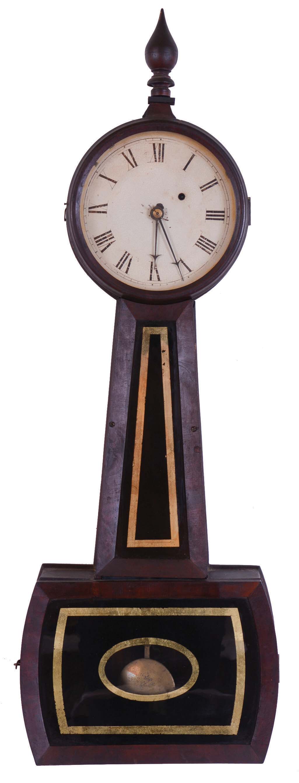 Unsigned, North Attleboro, Mass. attribution 8 days, weight brass movement Patent or banjo timepiece. This clock has different characteristics from the normal Attleboro clock in that the throat frame is attached with wood screws, the dial is attached with L-Turns and the hands are early style. The wood finial is a typical Attleboro design. — Antique Clocks Price Guide
