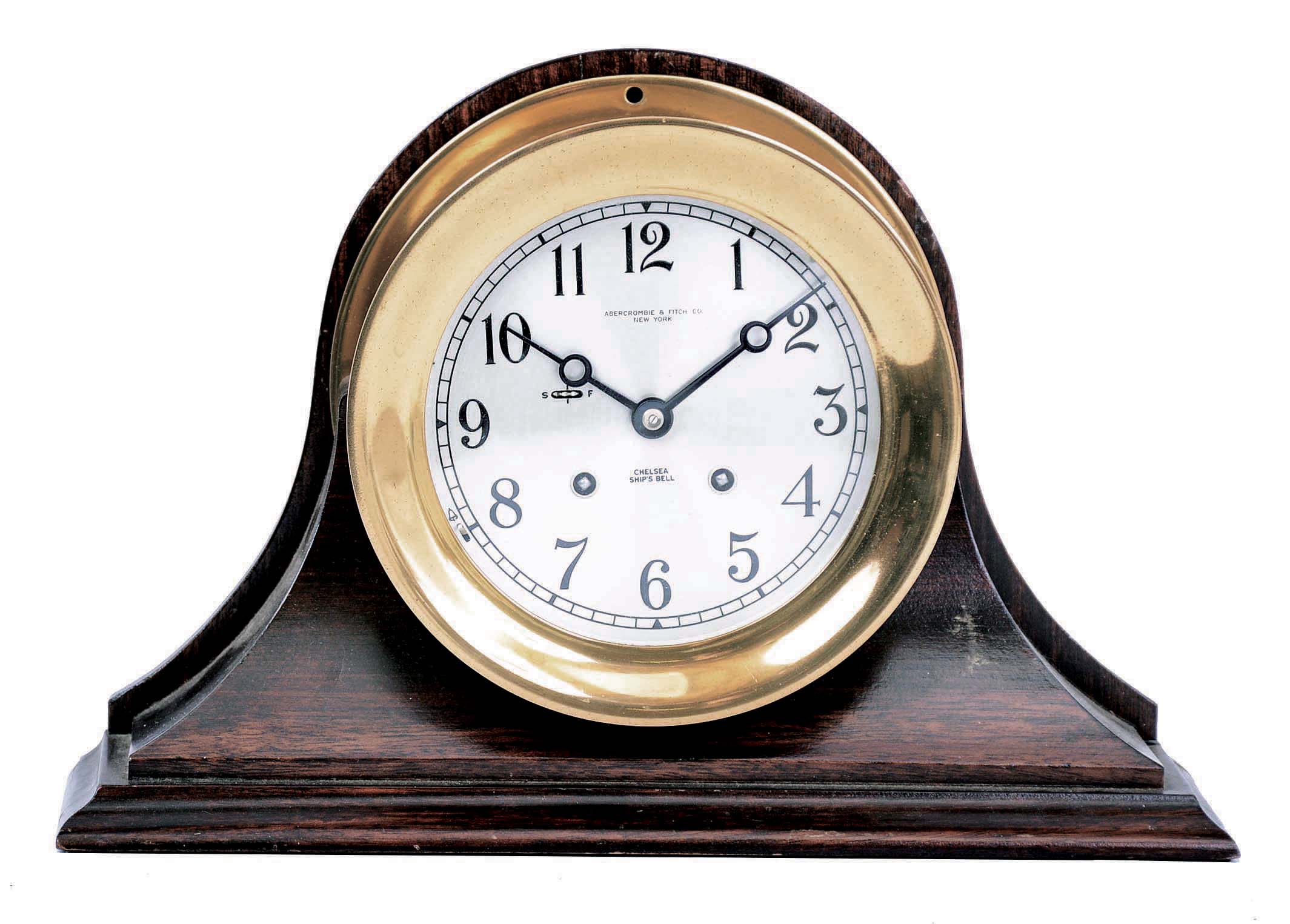 Chelsea Clock Co., Boston, Mass., "Commodore or Mahogany and Metal", 6" dial, 8 days, time and strike spring brass movement Ship's Bell clock. Serial No. 771100. On the case is engraved "William J. Catalane, Smooth Sailing - With Love, Anne B. Catalane, May 24th 1972". — Antique Clocks Price Guide