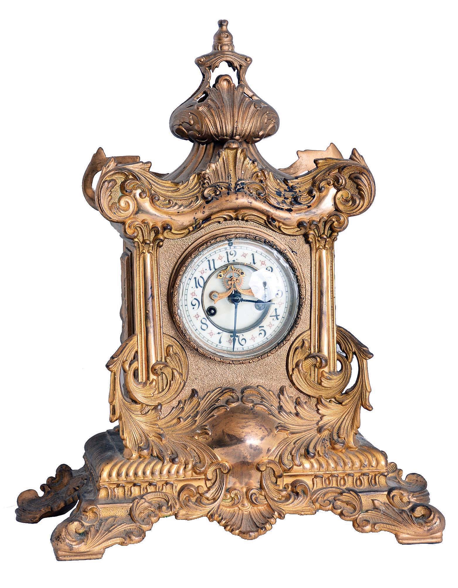 Waterbury Clock Co., Waterbury, Conn., "Chilson" crystal regulator with an 8 days spring driven time and half hour strike movement with visible escapement in a gilt cast spelter case. — Antique Clocks Price Guide