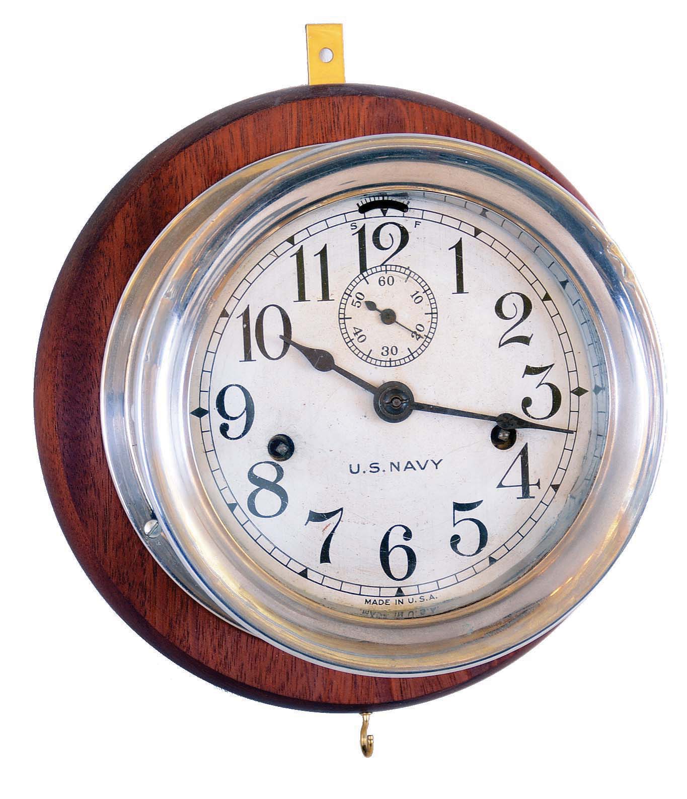 Seth Thomas Clock Co., Thomaston, Conn., nickel plated "Engine Lever" 8 day time only marine wall clock, mounted on newer mahogany backboard, hinged bezel. — Antique Clocks Price Guide