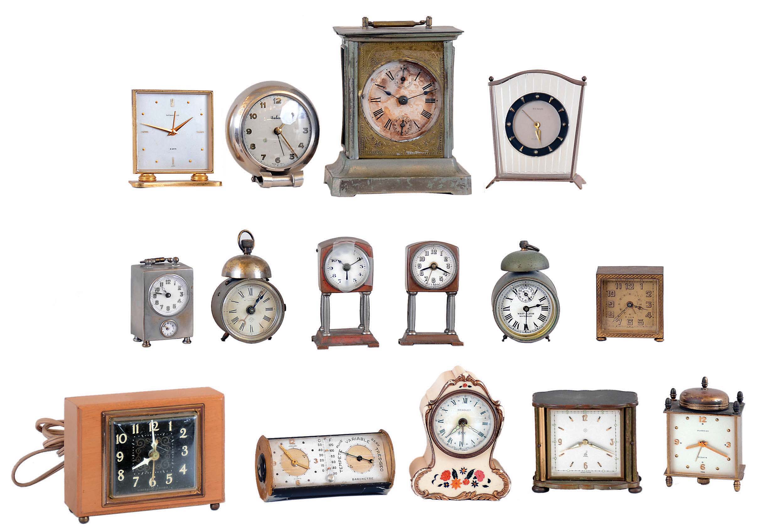 Clocks- 15 (Fifteen) Alarm in metal, wood and plastic cases, all wind-ups except for one GE plug-in electric, one with music box in base. Other names include Tiffany , Italora, Renzie, Ansonia, Waterbury, Gardier, Jaz, Bradley, Jaeger; all vintage — Antique Clocks Price Guide