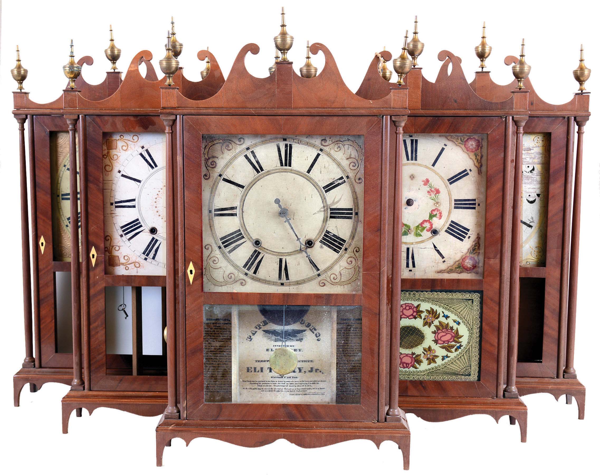 Clocks- 7 (Seven) pillar and scroll style: 6 (Six) reproductions finished hardwood cases with old 30 hour wooden movements and period dials and one period Seth Thomas — Antique Clocks Price Guide