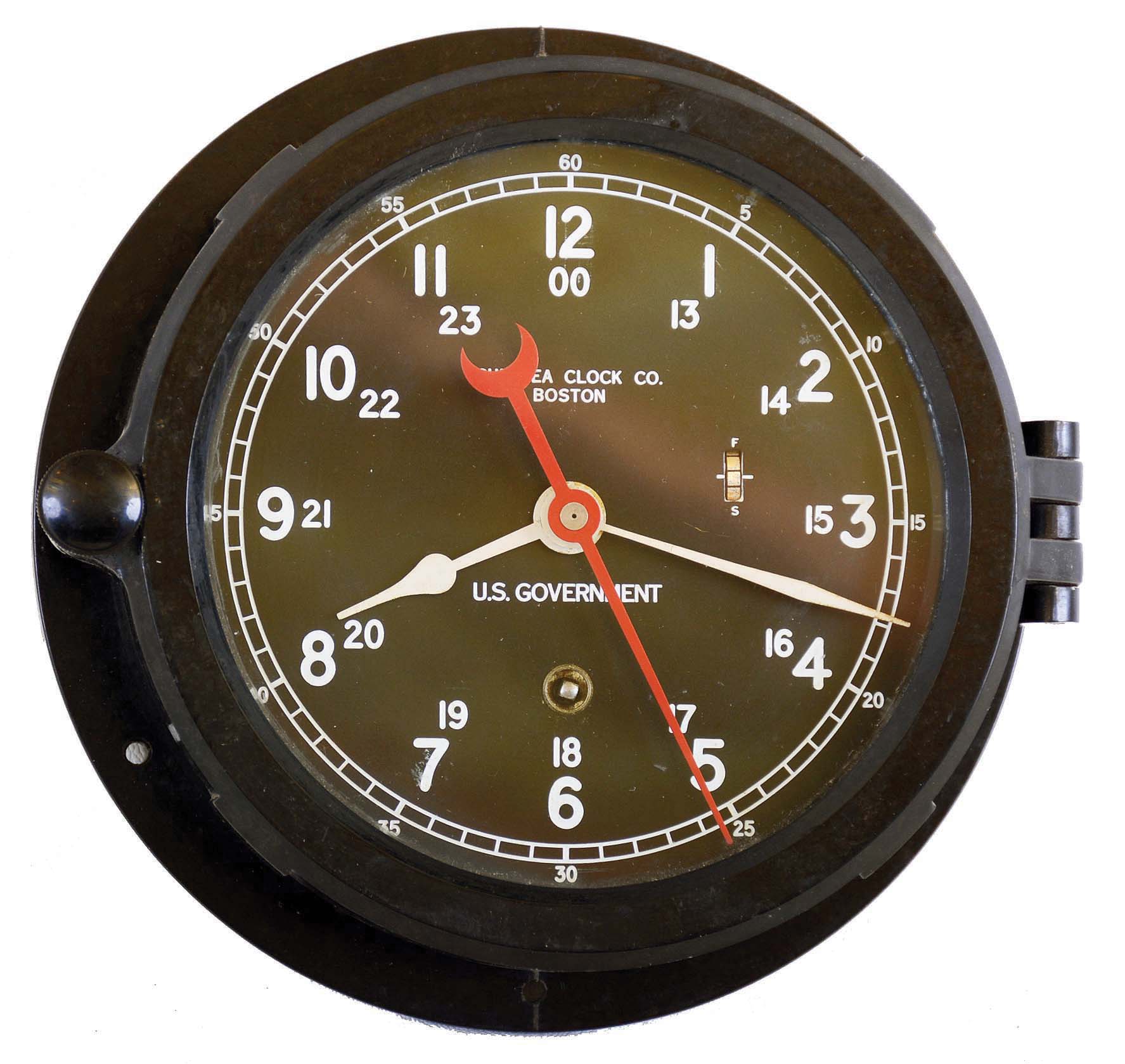 Chelsea Clock Co., Boston, Mass., U.S. Government phenolic hinged bezel 8 day time only marine clock, 5" black dial, #701578, "12E 1966" on back plate. — Antique Clocks Price Guide