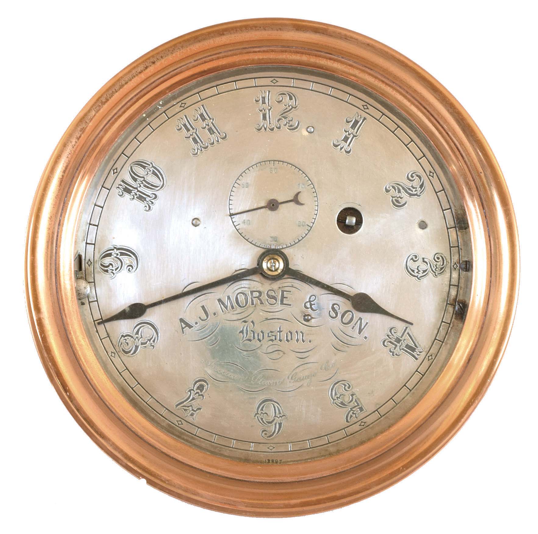 E. Howard & Co., Boston, Mass., for American Steam Gauge Co./ A.J. Morse & Son, Boston, Mass., "No. 69" style marine clock, round bronze case with mounting flange, 8 inch Arabic numeral silvered dial, blued steel spade hands, signed, 8 day brass timepiece with lever platform, scraped, lacquered plates and dust shields, movement #23, dial #12897 — Antique Clocks Price Guide