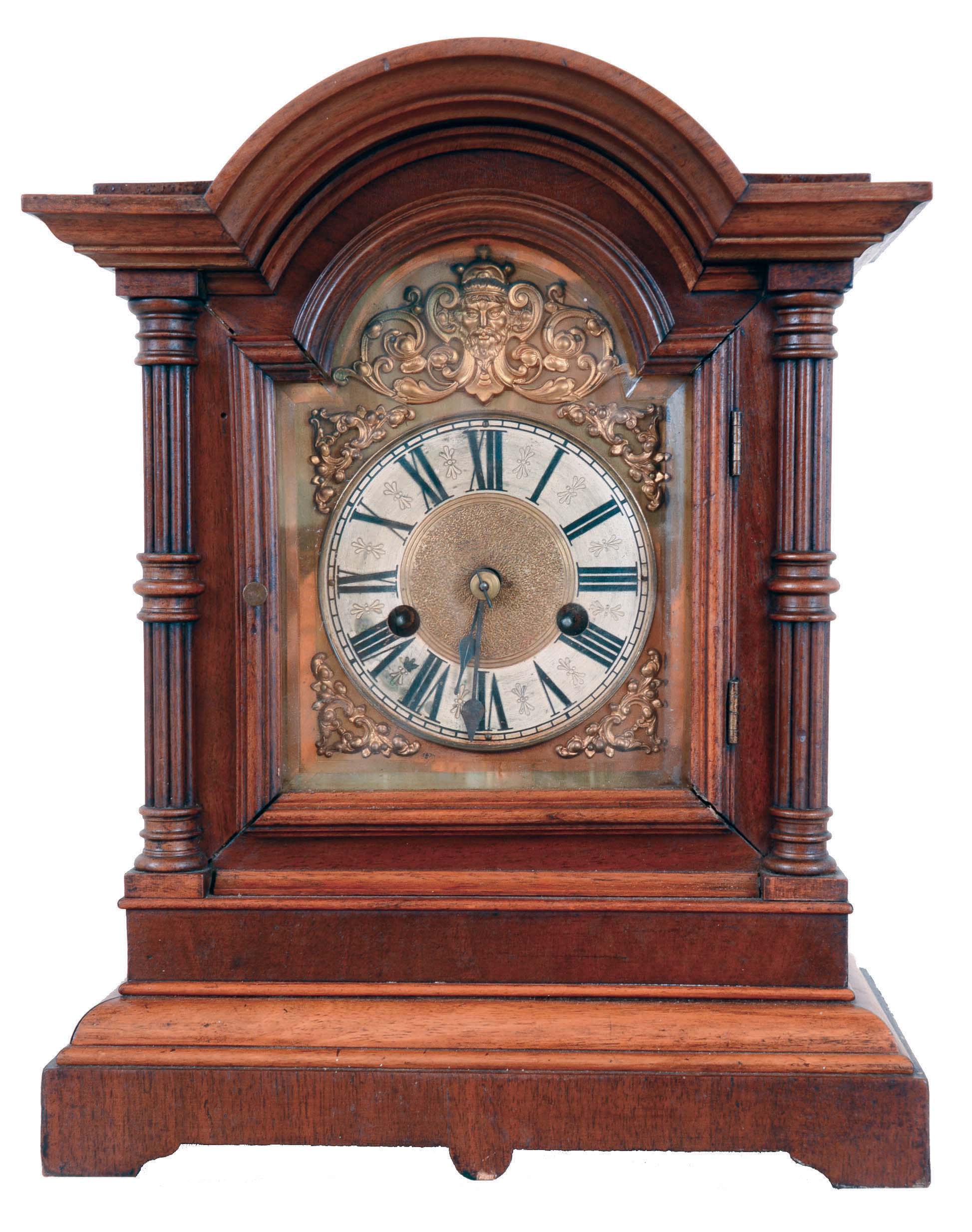 Germany, bracket clock, unsigned, 8 days, time and strike, spring driven movement in walnut arch topped case with 3/4 columns and brass dial with silvered chapter ring. — Antique Clocks Price Guide