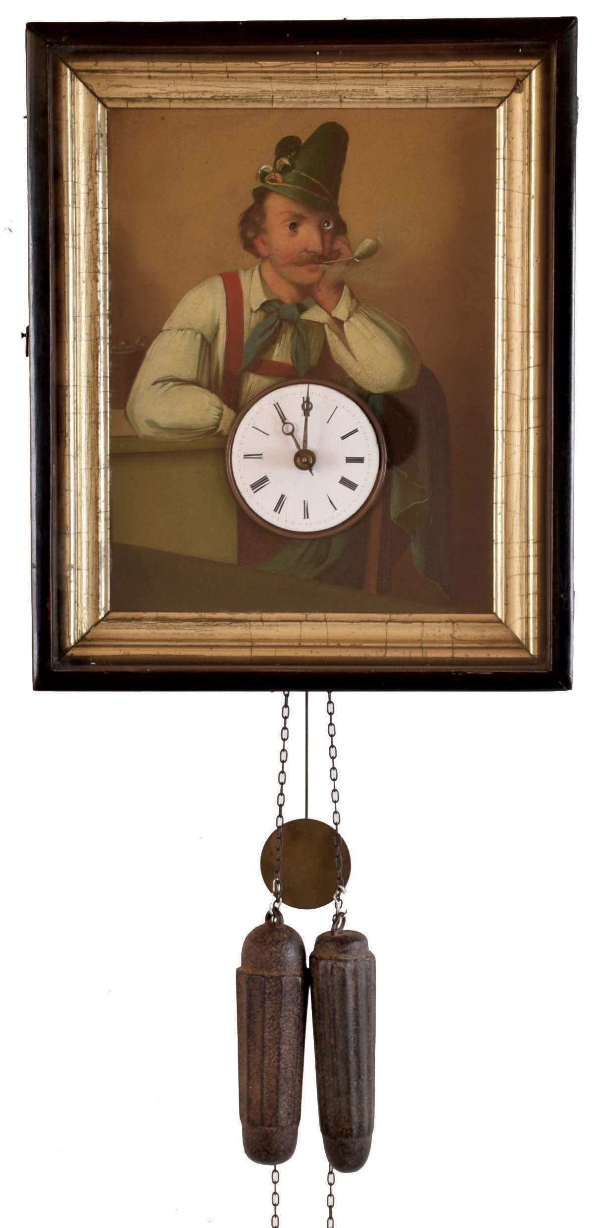 Black Forest, Augenwender or moving eye clock, ebonized, dovetailed softwood case, with inner gilt lining framing an oil painting of a man in a contemplative pose, smoking a pipe, his eyes moving back and forth as the clock runs, Roman numeral white enamel dial with steel Breguet style hands, 30 hour time and strike wood plate movement with brass wheels, cast iron weights and brass pendulum — Antique Clocks Price Guide