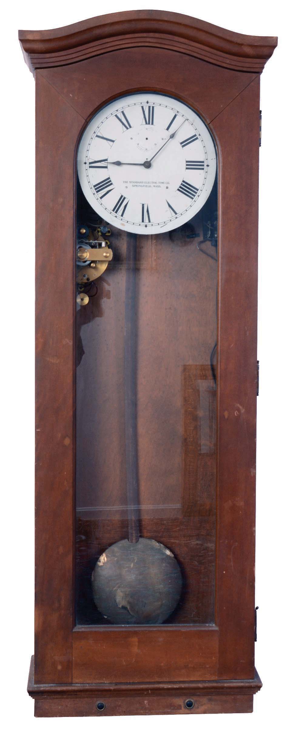 Standard Electric Time Co., Springfield, Mass., "Master Clock", time only, electrical driven movement in a mahogany case with a brass pendulum bob and painted metal dial and program module located under dial — Antique Clocks Price Guide
