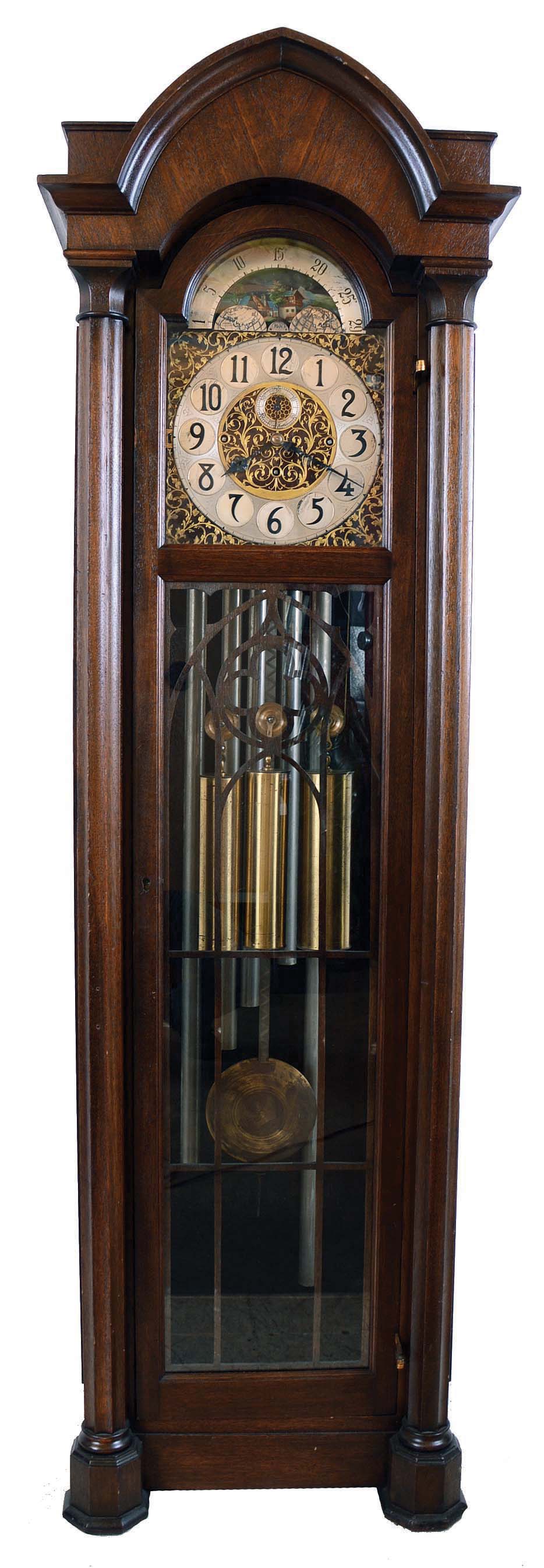 Winterhalder, Hans, Neustadt, Germany, hall clock, 8 days, time, strike and chime on 5 tubes playing Westminster tune, three brass weight driven movement in a mahogany case with brass dial with pierced spandrels and dial center, silvered chapter ring and moon phase. — Antique Clocks Price Guide