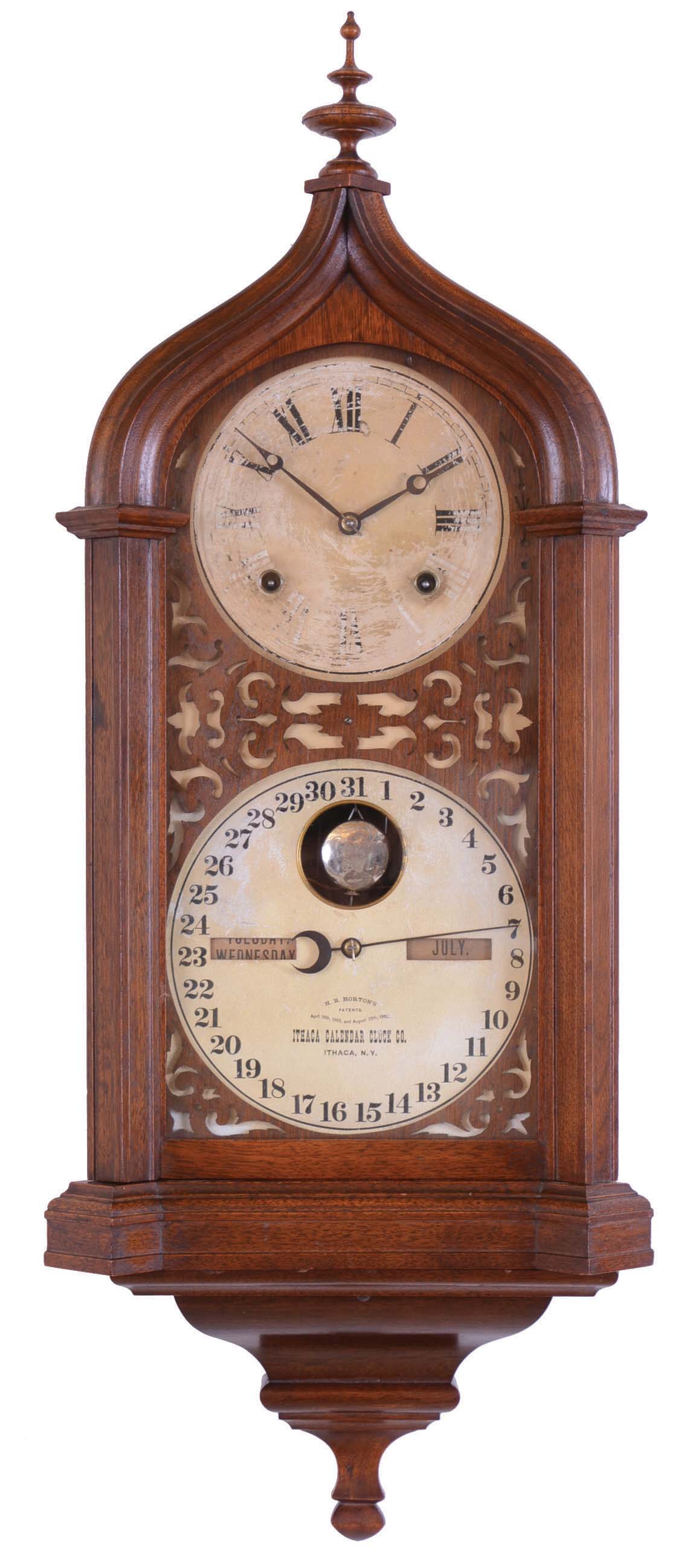 Ithaca Calendar Clock Co., Ithaca, NY, "Hanging Steeple" wall clock with a spring driven 8 days time and strike movement and a perpetual calendar mechanism in a walnut case. — Antique Clocks Price Guide