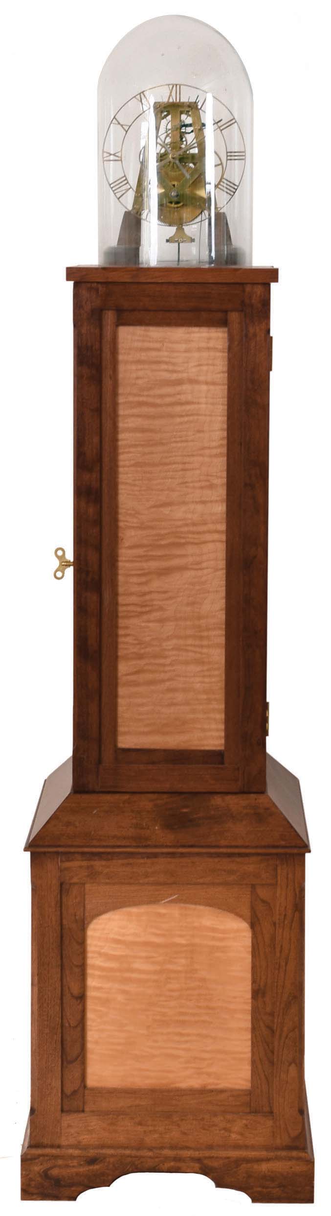 Donald Schaefer reproduction single train, 15 day duration, brass weight driven skeleton clock under dome on walnut cabinet with tiger maple panels. — Antique Clocks Price Guide