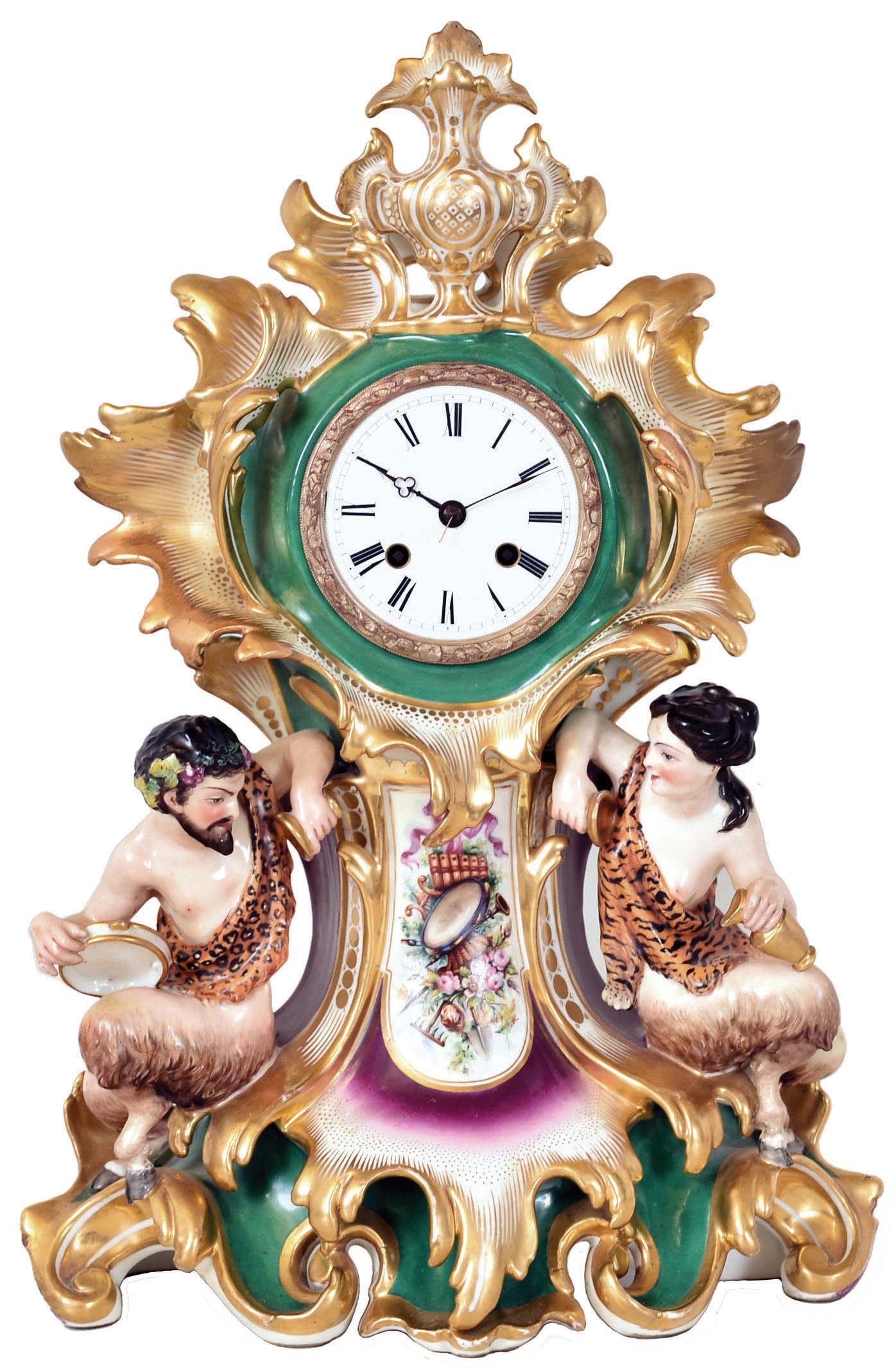Japy Freres, Paris, France, also marked Cardien, Paris & Cheron, polychrome painted porcelain figural mantel clock, 8 days, time and strike, spring driven movement with silk thread suspension in a highly decorative porcelain case featuring a male and female satyr flanking a painted horn of plenty with white enamel dial. — Antique Clocks Price Guide