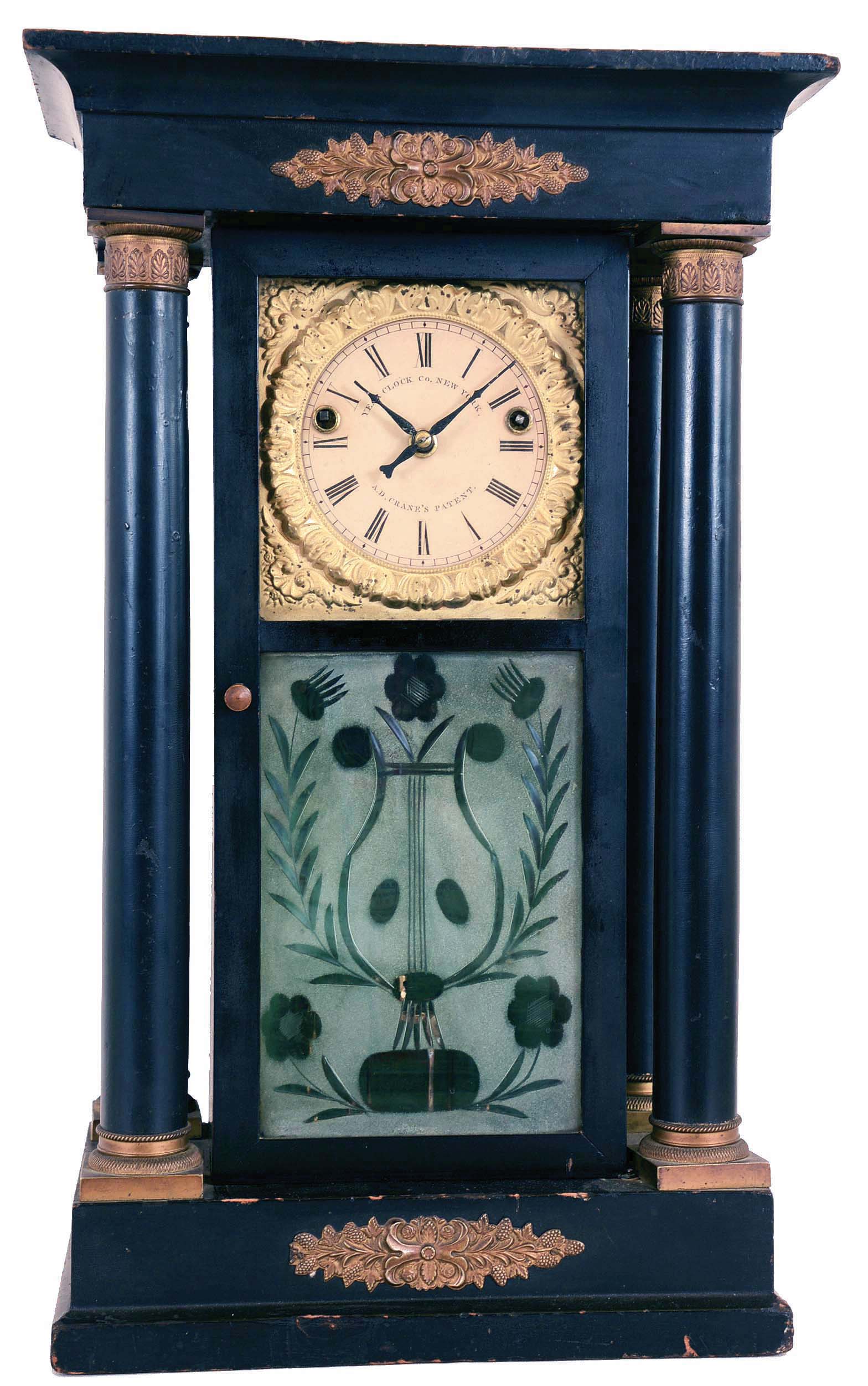 The Year Clock Co., New York, (Aaron D. Crane patent) , "Model D.2", One year, time and strike brass fusee-spring driven movement shelf clock with six-ball rotary pendulum. — Antique Clocks Price Guide