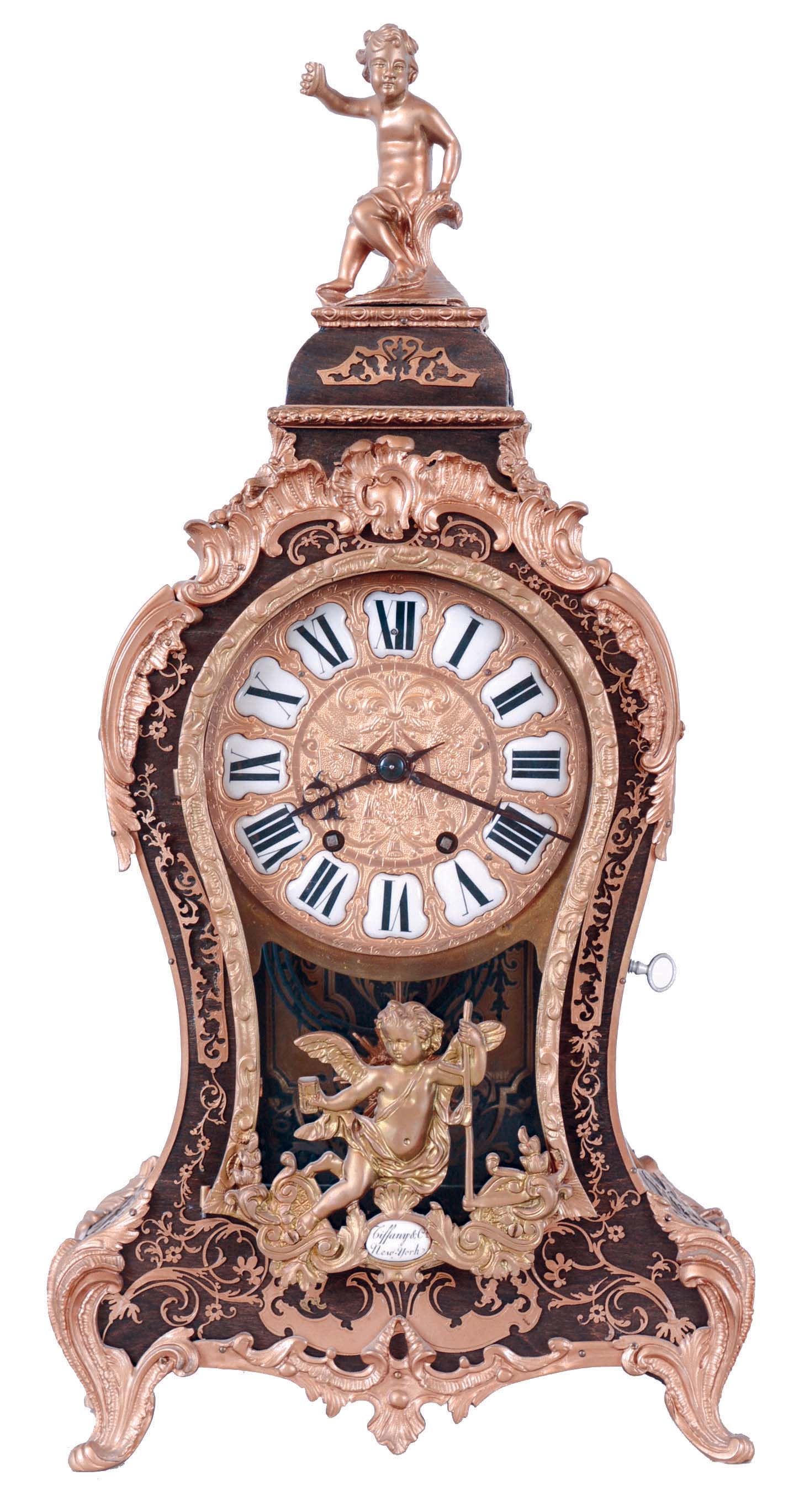 Tiffany & Co. bracket clock in the Louis XV style, 8 days, time and strike, spring driven movement in a case mounted with cast ornaments in the rococo style and enamel plaque with Tiffany signature, the top with putto, brass dial with Roman numeral cartouches — Antique Clocks Price Guide