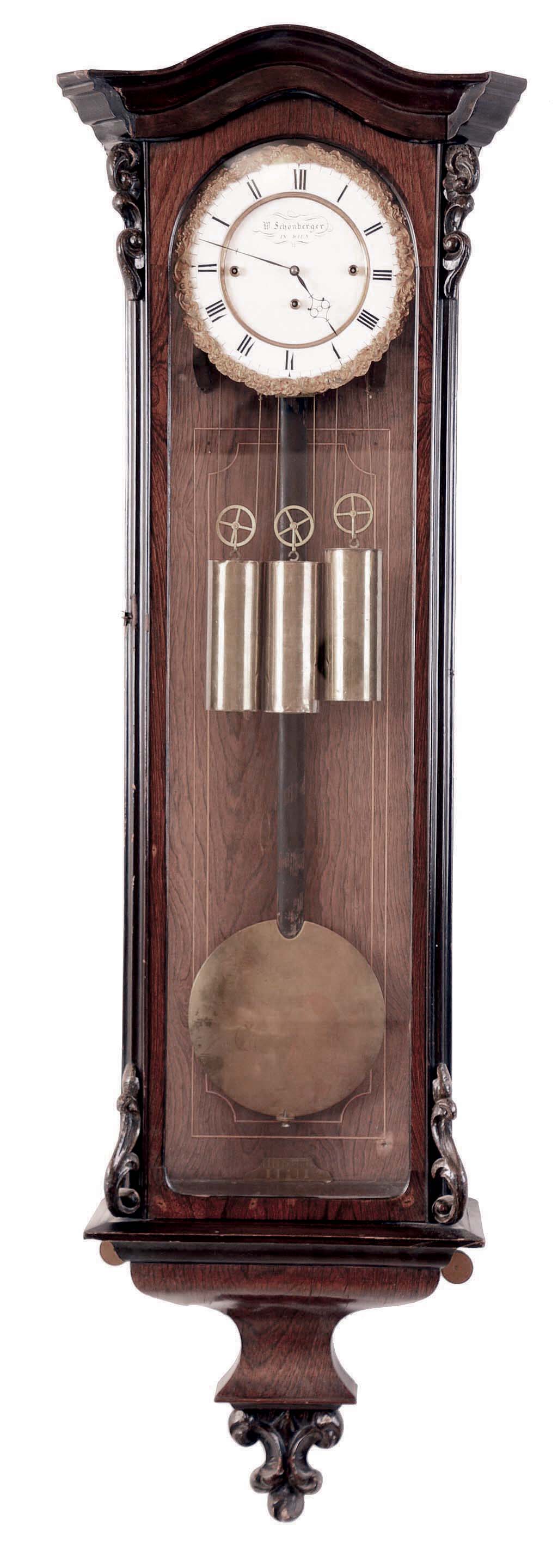 W. Schonberger, in Wien, Austrian 3-weight, Grand Sonnerie wall regulator in a rosewood veneer case with carved and stained accents. — Antique Clocks Price Guide