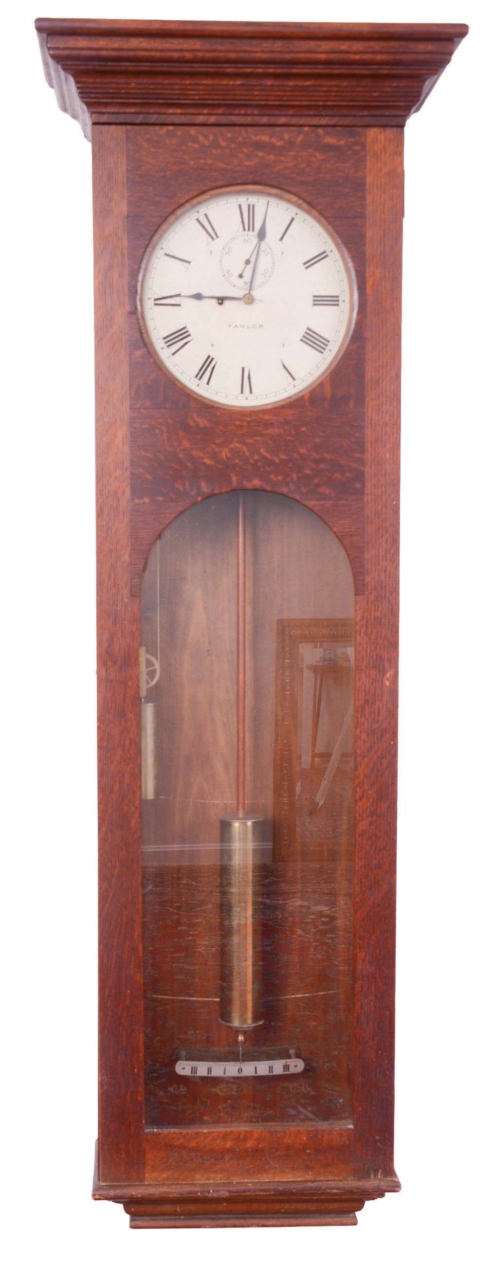 English Jeweler's regulator wall clock signed "Taylor", 8 day, time only, brass compounded weight driven movement with Graham deadbeat escapement and maintaining power in a quarter sawn oak case with painted metal dial. — Antique Clocks Price Guide