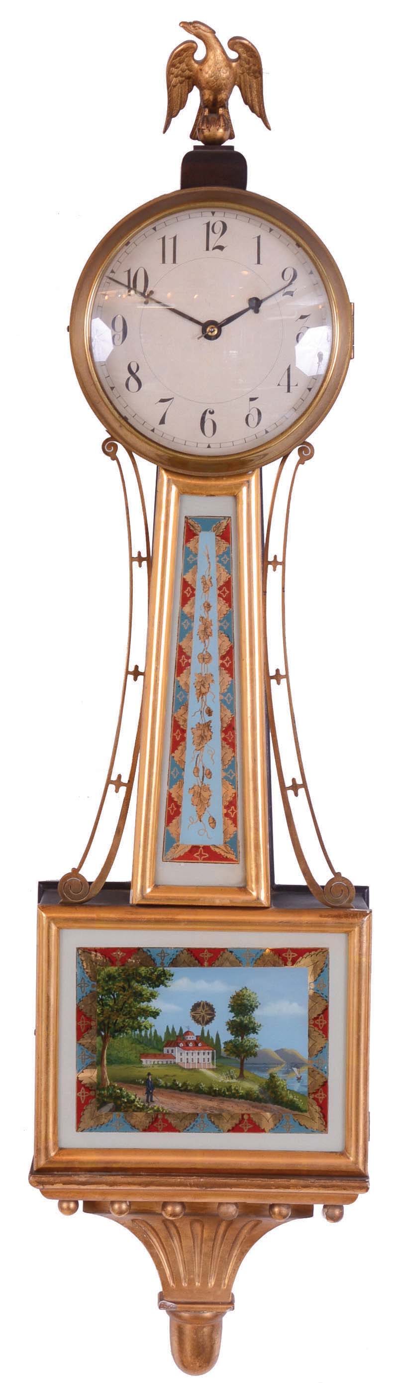 Herschede Hall Clock Co., Cincinnati Ohio, "Banjo" wall clock with a weight driven 8 day time only movement in mahogany case with reverse painted throat and lower tablets, gilt throat frame, lower door and base frame. — Antique Clocks Price Guide