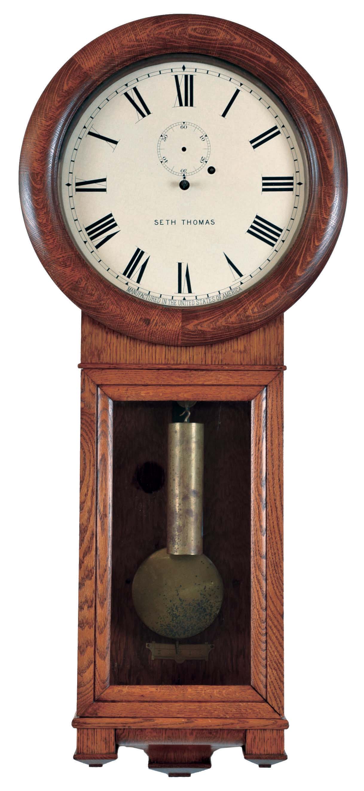 Seth Thomas Clock Co., Thomaston, Conn., "Regulator No. 2" wall hanging clock with a weight driven 8 day timepiece movement in an oak case. — Antique Clocks Price Guide