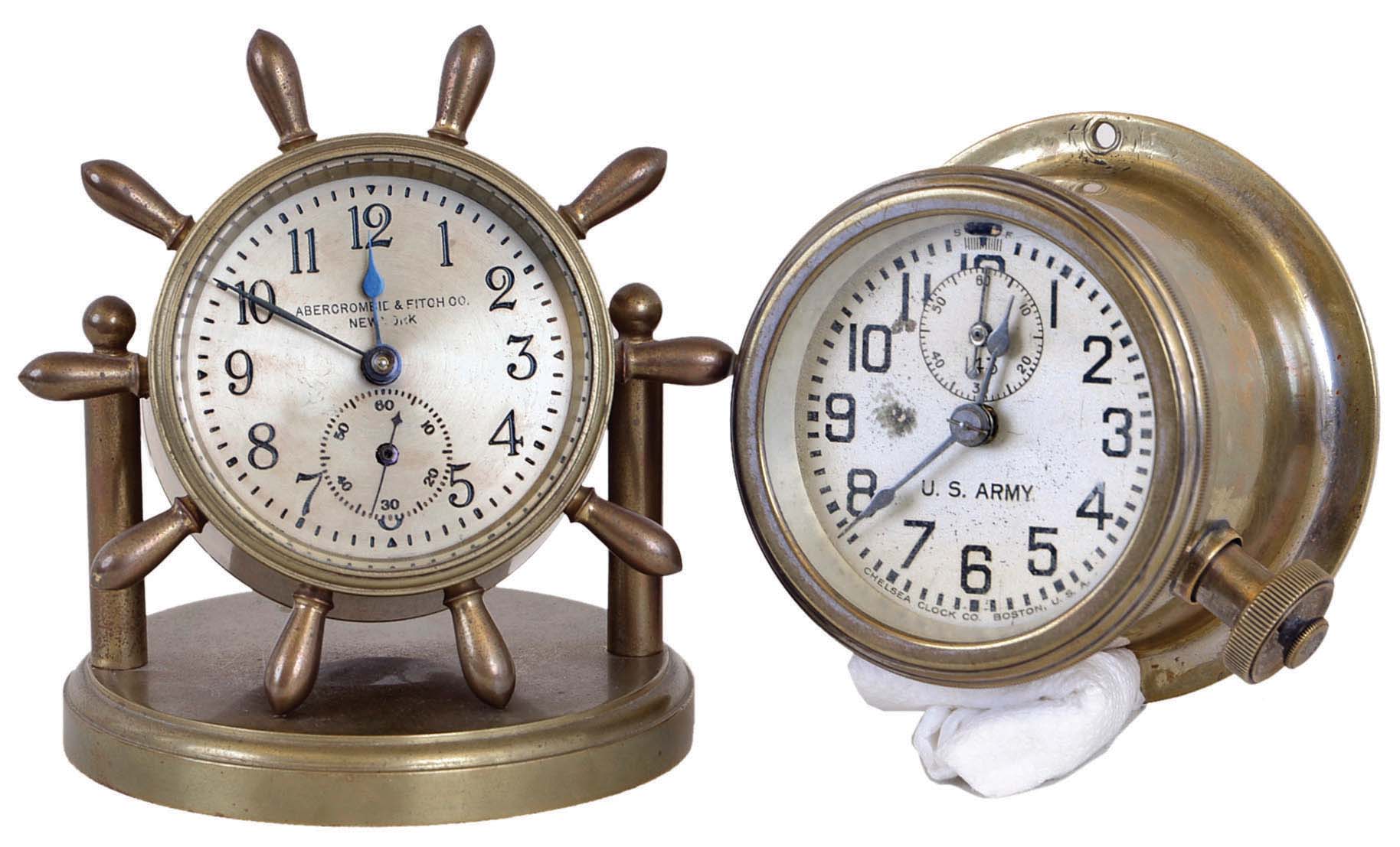 Clocks- 2 (Two): (1) Chelsea Clock Co., Boston, Mass., "U.S. Army 143", 8 day, spring brass lever movement truck or vehicle timepiece. Serial No. 142877, c1920 (2) Chelsea Clock Co., Boston, Mass., "Clinton" 8 day, spring brass lever movement ship's wheel desk timepiece. Serial No. 9147, c1903 — Antique Clocks Price Guide