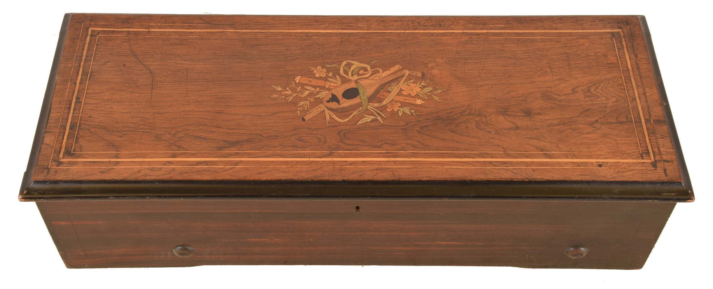 Switzerland, 8 tune music box, rosewood veneered top with marquetry trophy featuring musical instruments, the sides with rosewood graining, and the inside of the lid with tune card, 13 inch cylinder with one piece comb — Antique Clocks Price Guide