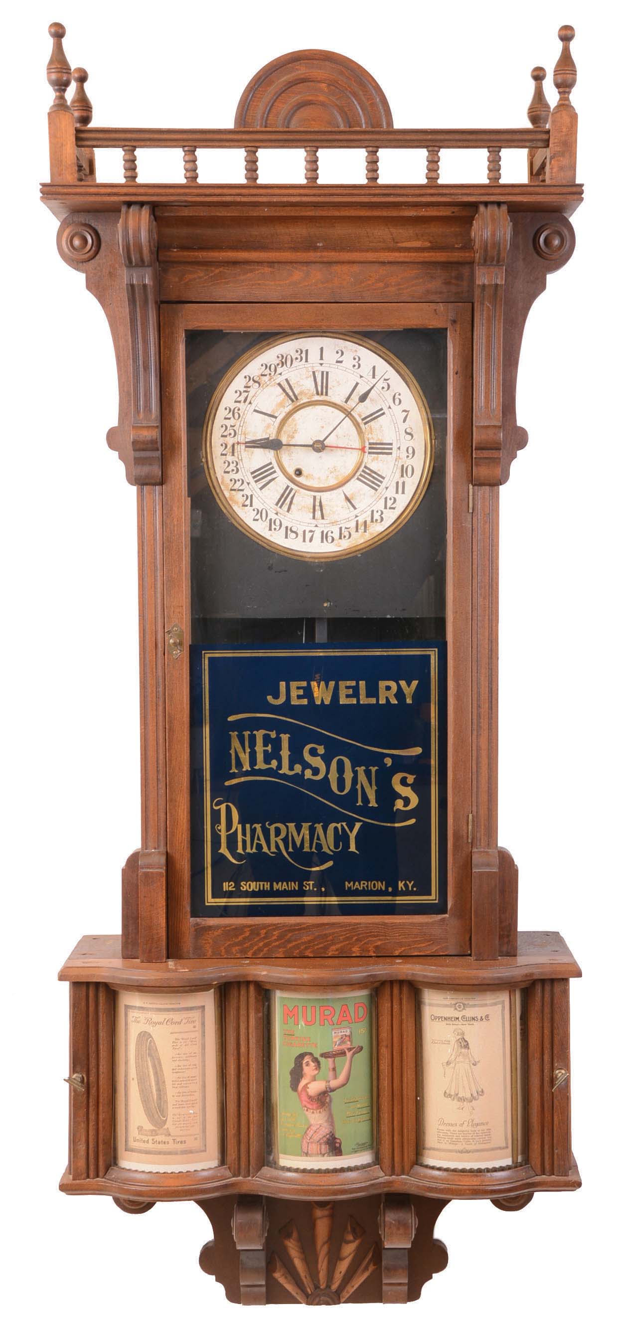 Sidney Advertising Clock Co., Sidney, Otsego County, New York, Huge "Advertising", wall clock, 8 days, time and calendar, spring driven movement in a soft wood case with a, papered metal dial, reverse painted tablet and papered advertising rolls driven by a separate movement rotating every five minutes. — Antique Clocks Price Guide