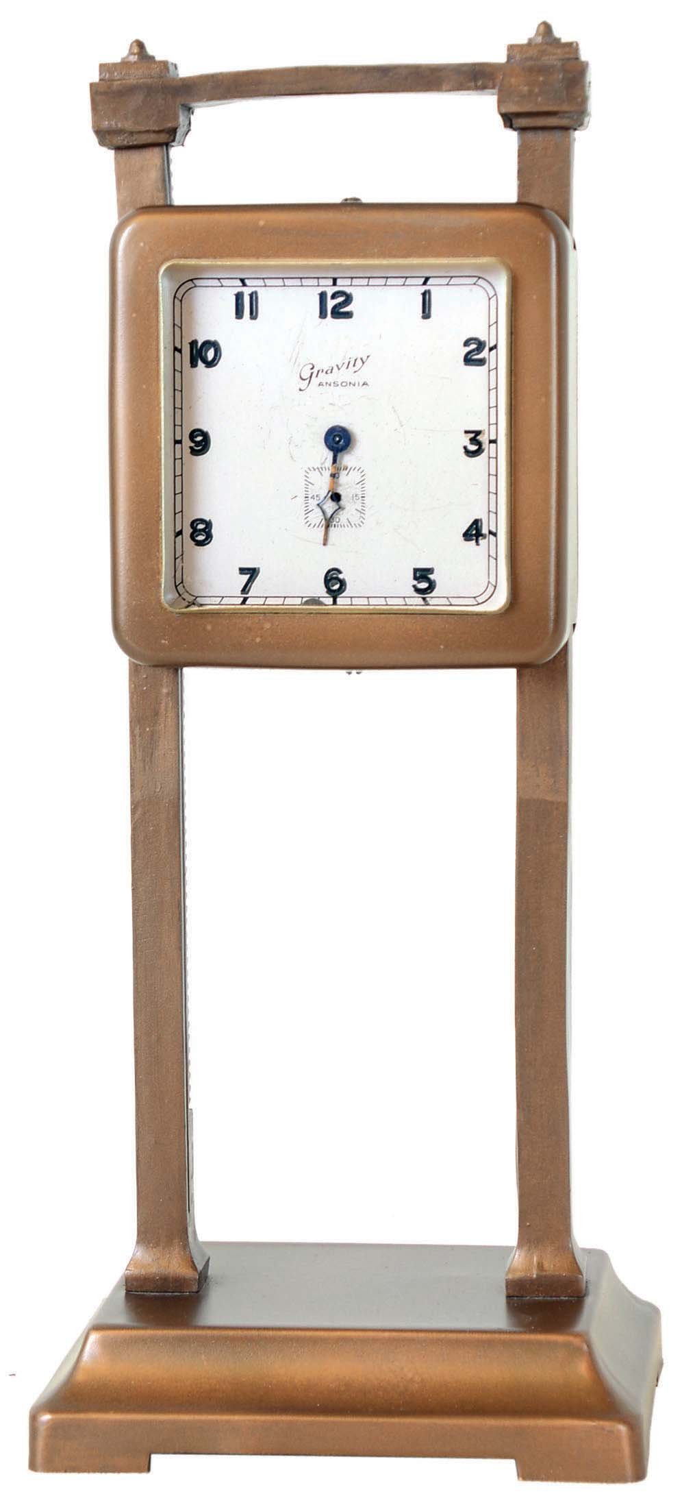Clocks- 13 (Thirteen) desk and table clocks including (1) Ansonia Clock Co., New York, NY, "Gravity Clock" 36-hour time only novelty clock c1924; (2) Ansonia Clock Co., New York, NY "Jumper No. 2", 30 hour, bobbing or bouncing doll novelty timepiece, c1886; (3) an automatic car clock and ten miscellaneous mostly modern — Antique Clocks Price Guide