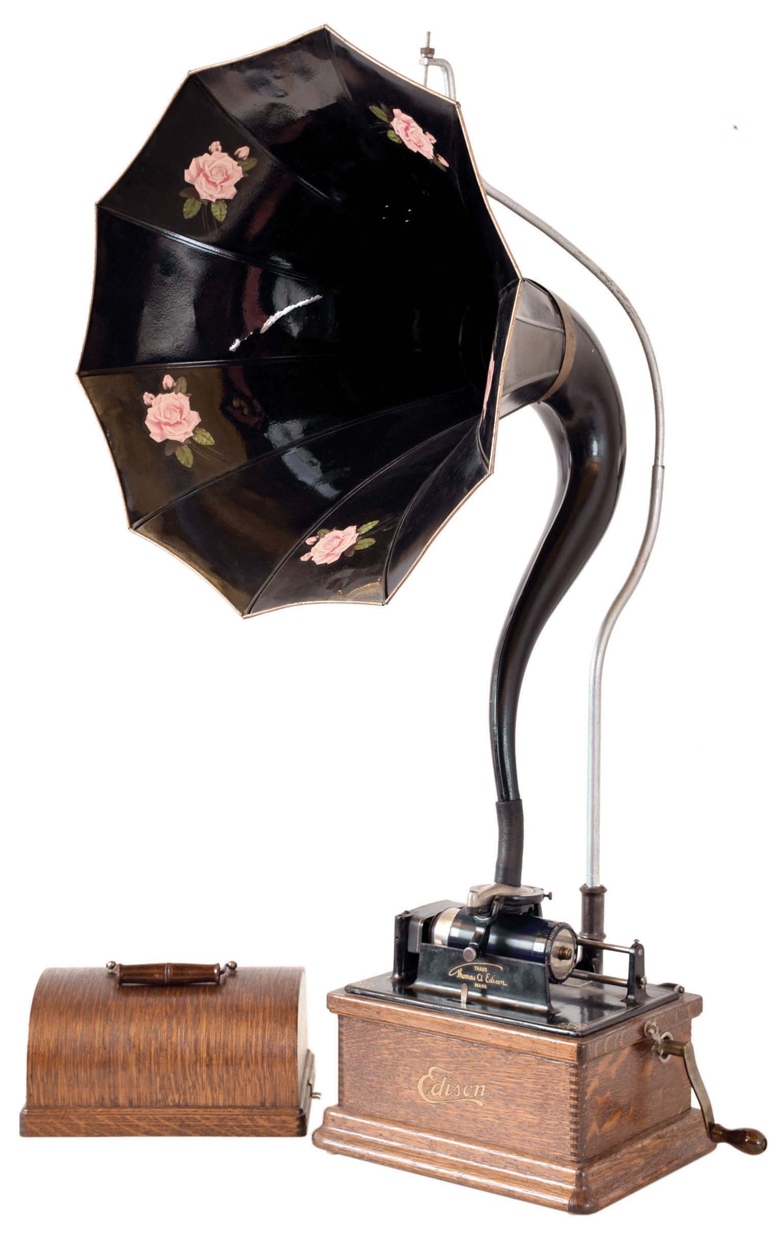 Thomas A. Edison, East Orange, NJ. "Fireside" combination 2 & 4 minute photograph with a cygnet horn, This example has a diamond stylus reproducer now for playing 4-minute Blue Amberol records. — Antique Clocks Price Guide