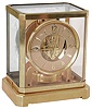 LeCoultre, Switzerland, for Cartier, Atmos clock, gilt, 15 jewel calibre 519 movement, Arabic numeral and arrow marker silvered dial, signed "Cartier" below 12, gilt case with glazed dome, serial #36412, c1950